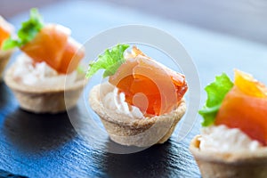 Mini smoked salmon pastry tartlets for catering.