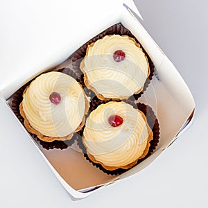 Mini tart with fresh white custard in paper box