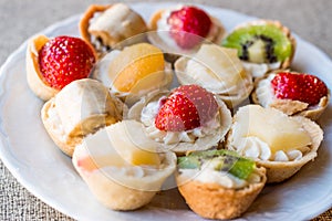 Mini Tarts, Tartolet or Tartlets with cream and fresh fruit