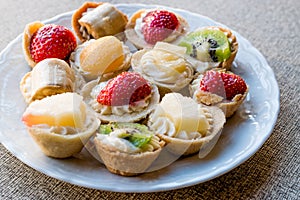 Mini Tarts, Tartolet or Tartlets with cream and fresh fruit