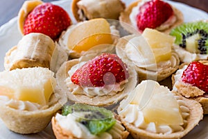 Mini Tarts, Tartolet or Tartlets with cream and fresh fruit