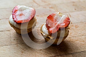 Mini Tarts, Tartolet or Tartlets with Strawberry, Cream and fresh fruits.