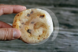 Mini traditional Egyptian flat bread with wheat bran and flour, small Aish Baladi or small bread baked in extremely hot ovens, it