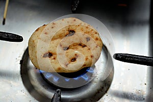 Mini traditional Egyptian flat bread with wheat bran and flour, small Aish Baladi or small bread baked in extremely hot ovens, it