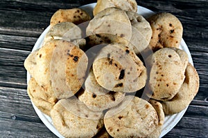 Mini traditional Egyptian flat bread with wheat bran and flour, small Aish Baladi or small bread baked in extremely hot ovens, it