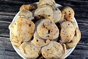 Mini traditional Egyptian flat bread with wheat bran and flour, small Aish Baladi or small bread baked in extremely hot ovens, it