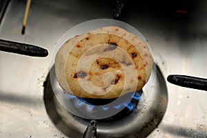 Mini traditional Egyptian flat bread with wheat bran and flour, small Aish Baladi or small bread baked in extremely hot ovens, it