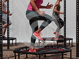 Mini Trampoline Workout: Girl doing Fitness Exercise in Class at