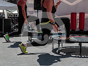 Mini Trampoline Workout: Girl doing Fitness Exercise in Class at Gym