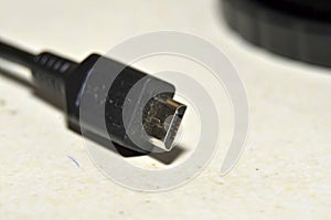 Mini USB power adapter, close up photo tip to connect the phone.