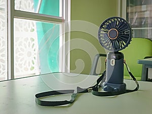 The mini USB powered fan is being charged