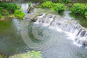 Mini waterfall in the city park. Beauty in nature