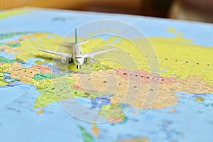 Miniature Airplane Isolated on World Map