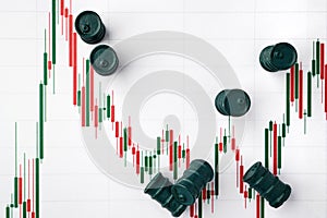 Miniature barrels and graphs of stock fluctuations. Selective focus. The concept of rise and fall in the value of oil products and