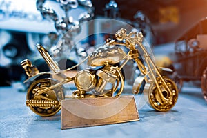 Miniature bike model made of nuts and bolts