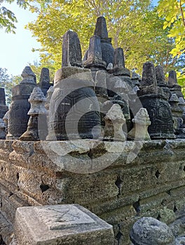 The miniature Borobudur temple looks dull and unmaintained