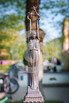 A miniature bronze sculpture of the monument of freedom Milda in Riga