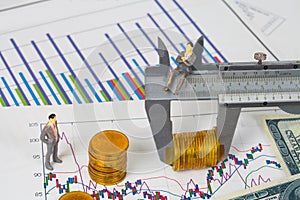 Miniature business man and vernier measuring