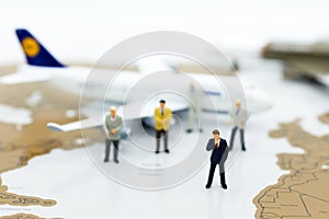 Miniature business people : businesses team with plane. Image use for background travel, business trip travel advisory agency