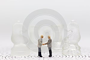 Miniature businessman: Businessman make deal for business together. Image use for business concept