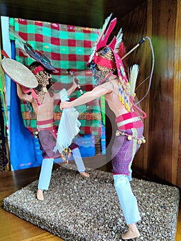 a miniature of the caci dance which is a traditional war dance of east Manggarai tribe displayed on shop in airport for sold photo