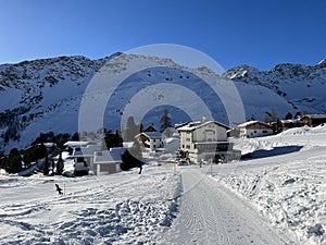 A miniature cemetery covered with fresh snow next to Arosa\'s mountain chapel (Das Bergkirchli Arosa)