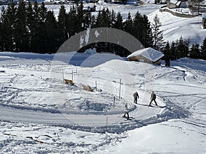 A miniature cemetery covered with fresh snow next to Arosa's mountain chapel (Das Bergkirchli Arosa)