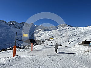 A miniature cemetery covered with fresh snow next to Arosa's mountain chapel (Das Bergkirchli Arosa)