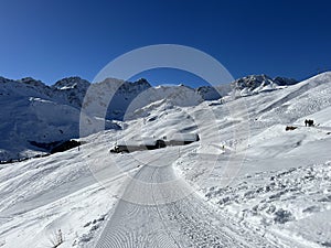 A miniature cemetery covered with fresh snow next to Arosa\'s mountain chapel (Das Bergkirchli Arosa)