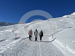 A miniature cemetery covered with fresh snow next to Arosa's mountain chapel (Das Bergkirchli Arosa)