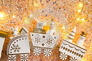 Miniature Christmas toy made of wood. Christmas train with gifts decorated with winter ornaments