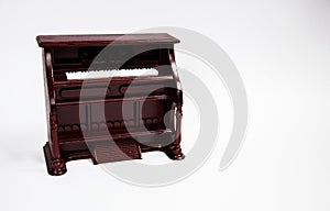 Miniature classical piano keyboard instrument isolated on white background