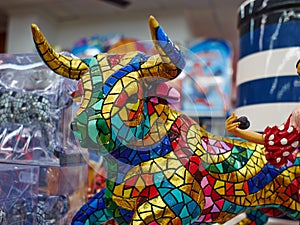 Miniature colorful statue of bull in Gaudi style - traditional s photo