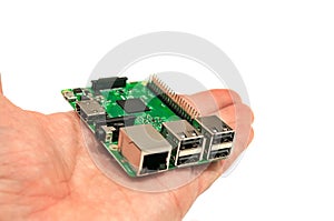 Miniature computer on the palm of hand.