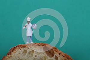 Miniature of cook with bread