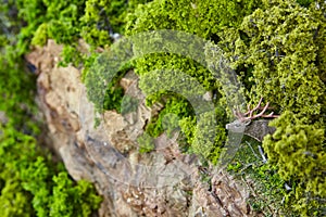 Miniature Deer Figurine in Lush Moss Landscape