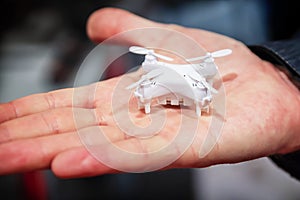 A miniature drone in hand