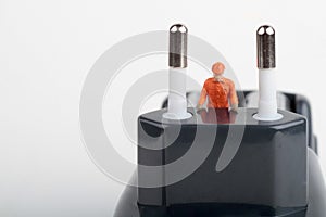 Miniature of electrician on a plugin