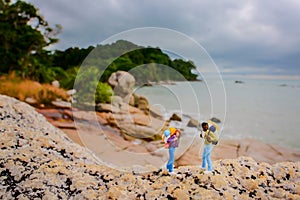 Miniature figure  adventure  the beach take pictures with slow speed technique at trikora island bintan beach