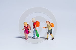 Miniature figure concept of childrens going to school