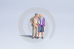 Miniature figure concept of couple senior people