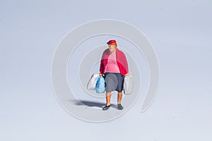 Miniature figure concept of female shopping