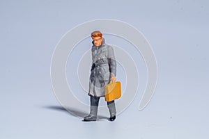 Miniature figure concept of Man walking and traveling