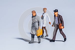 Miniature figure concept of people walking and traveling
