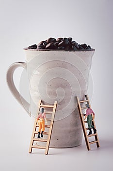 miniature figure, gunning, stairs up to the coffee cup