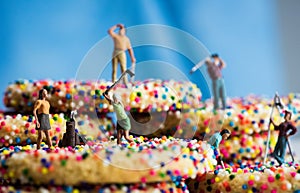 Miniature Figures Golfing on Sprinkle Cookies