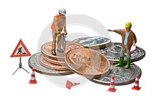 Miniature figures working on a heap of Dollar coin