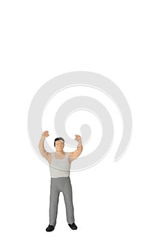 miniature figurine of a man lifting and looking at something