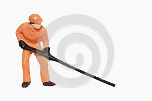 miniature figurine of a worker lifting something with a lever