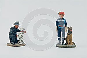 Miniature of firemen and their dogs